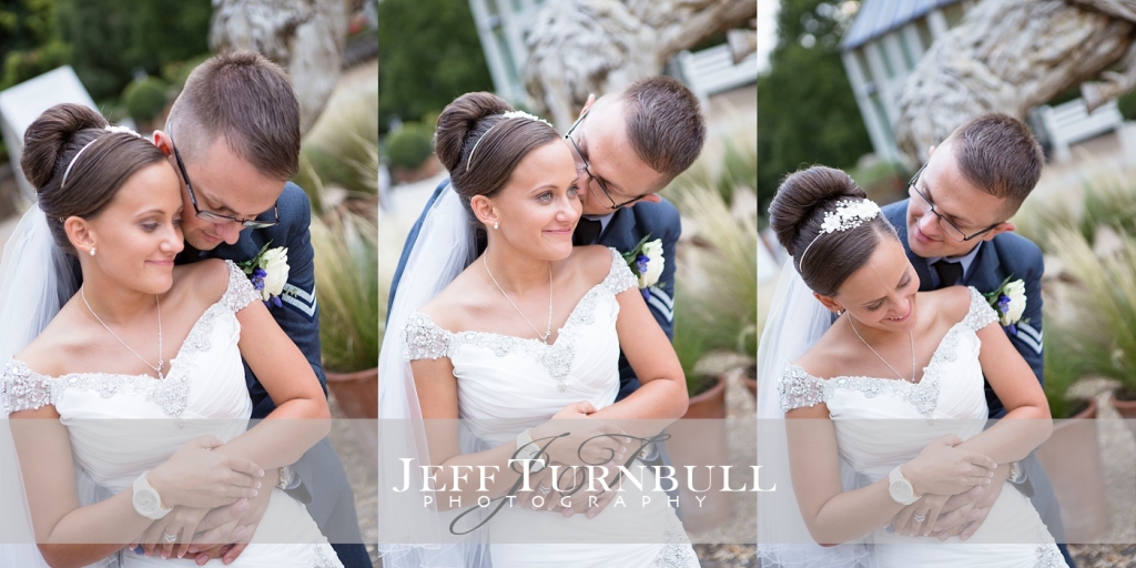 Oakley Court Hotel wedding photography of the bride and groom cuddling