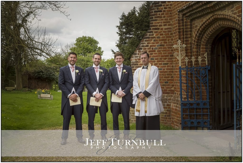 Groomsmen outside St Mary's Church High Easter