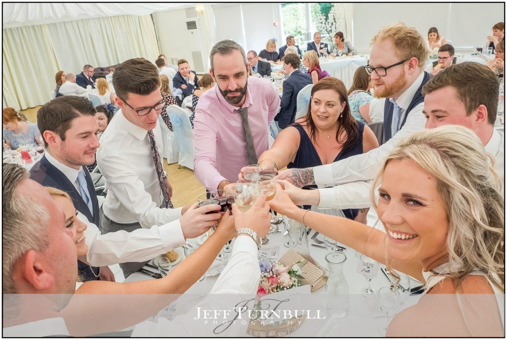 Wedding Guests Toasting Bride and Groom