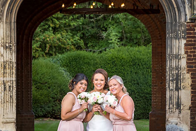 Bride and Bridesmaids by the Tower at Leez Priory