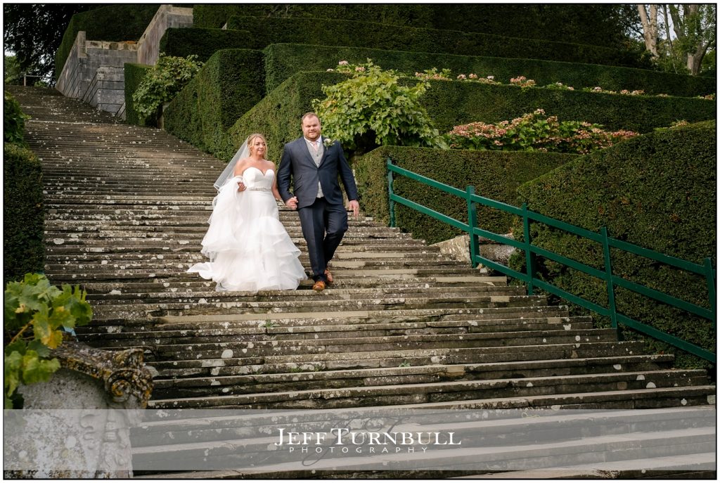 Bride and Groom Walking Down Steps