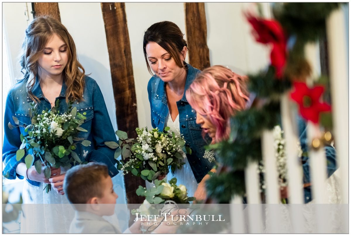 Bridesmaids talking with the pageboy