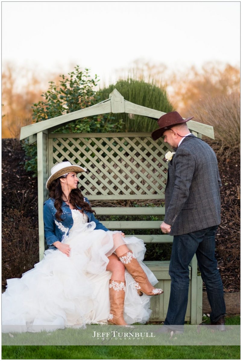 Bride and groom together wearing their country and western outfits