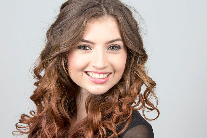 Female Model With Wavy Hair and White Teeth