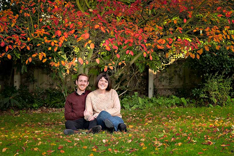 Engaged Couple Under a Colourful Tree