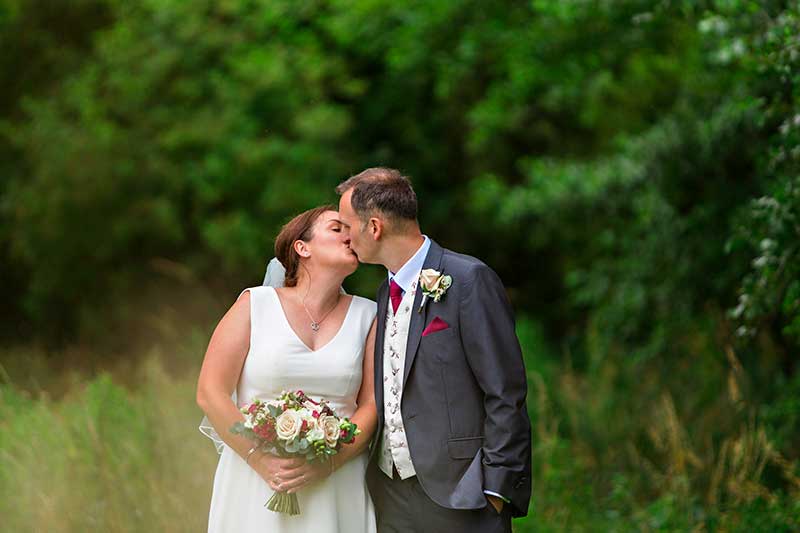 Close Up Photo of the Bride and Groom Kissing
