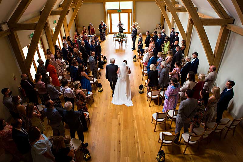 Bride and Dad Walking up the Aisle in the Barn at Easton Grange
