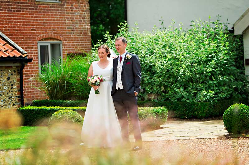 Bride and Groom Standing Together Outside Easton Grange
