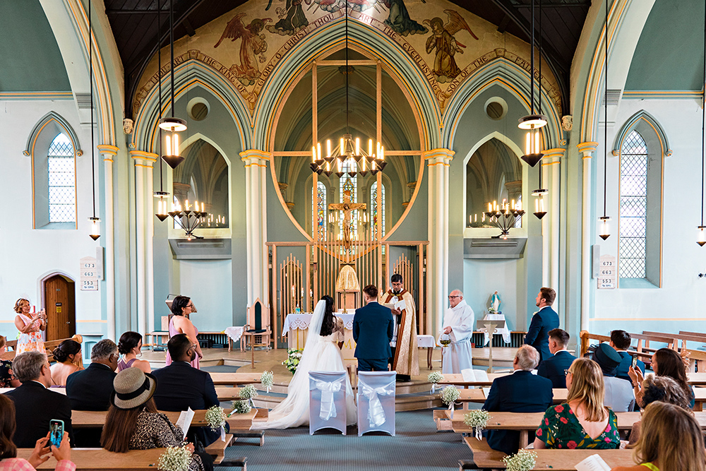 Christian Wedding Photographer | Bride and Groom at the Alter